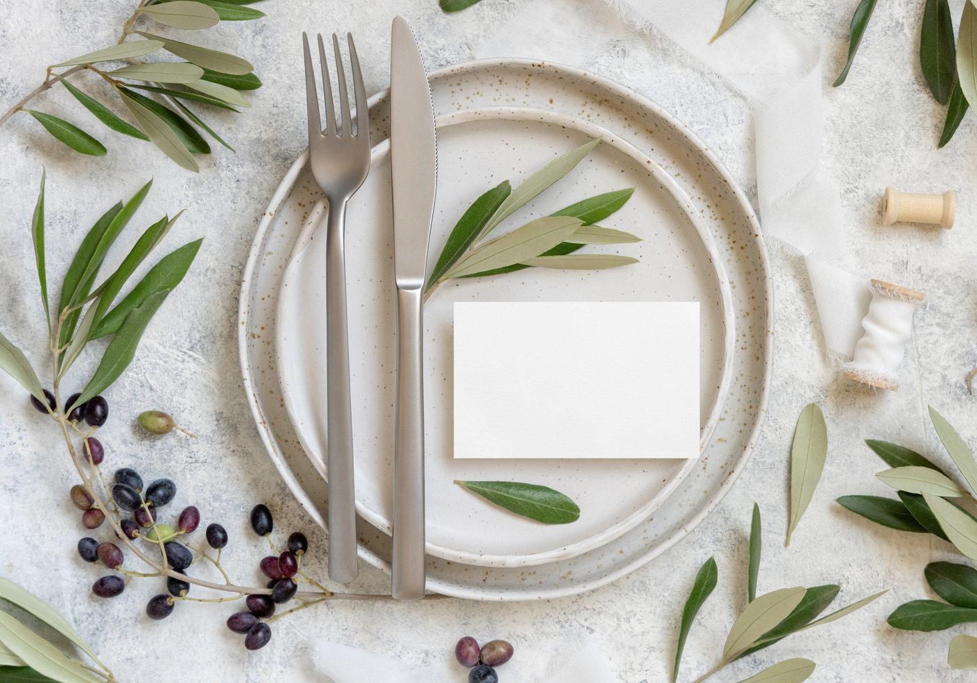 Wedding Table Setting Decorated with Olive Branches